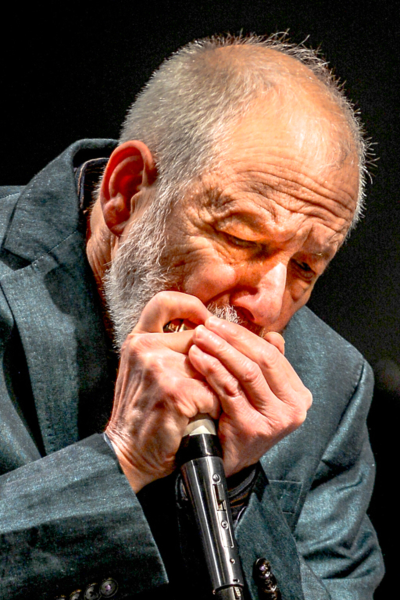 Corky Siegle performs the harmonica during the Saturday performance on the Blizzard Theater.