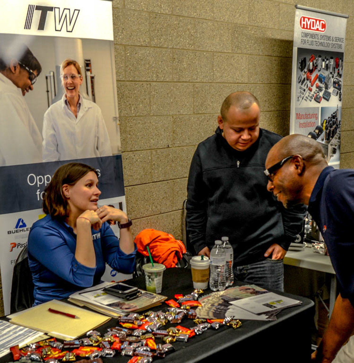 The Shakeproof Division of ITW (Illinois Tool Works) discusses job possibilities with visitors to the Job and Career Fair in Building O on Oct. 25.