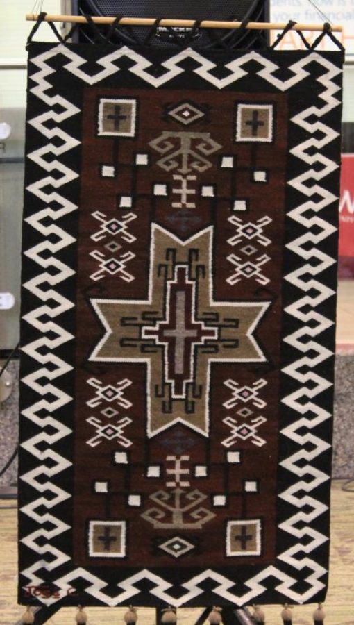 A South American rug that hung to the right of the performing group Sisai on Nov. 15.