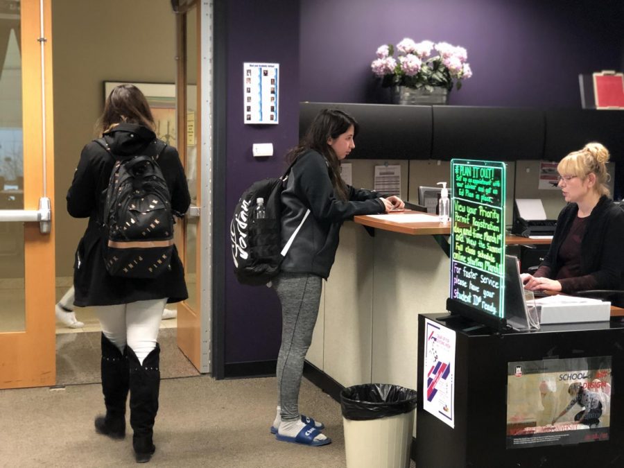 Although students are now allowed to schedule an appointment through their computer or phone, many of them still walk into the Advising office to make one.