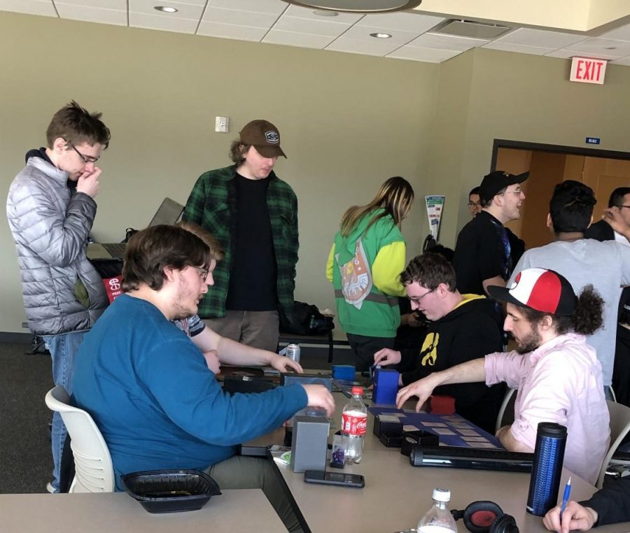 Gamers play Magic: The gathering together at ECC Gamers United meeting.