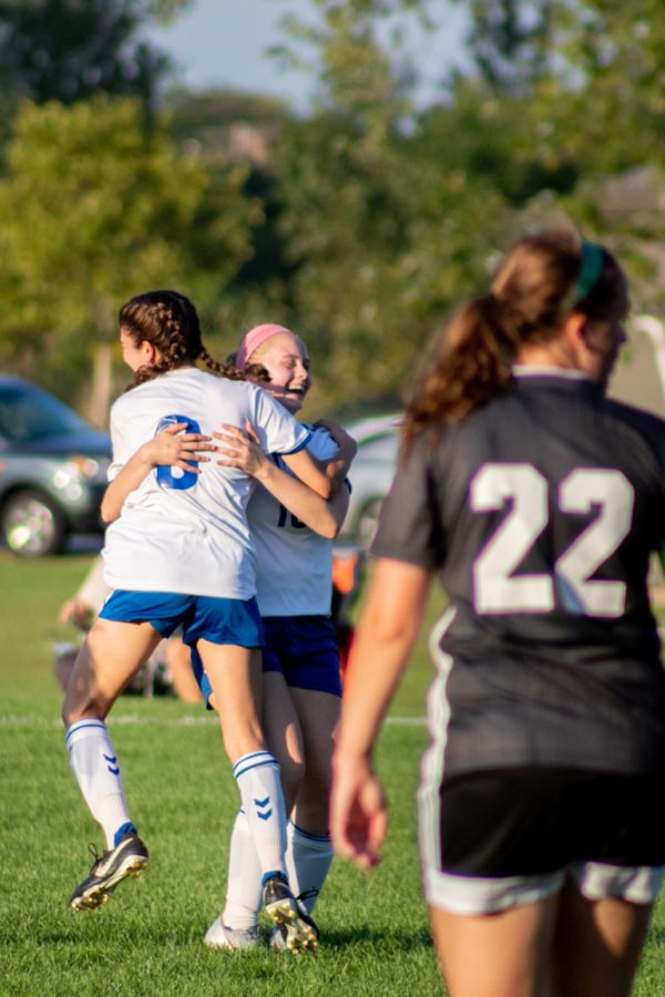 Kaley Kowal (8) and Natalie McGinnis (10) with a celebration hug for winning their game on Sept. 18.