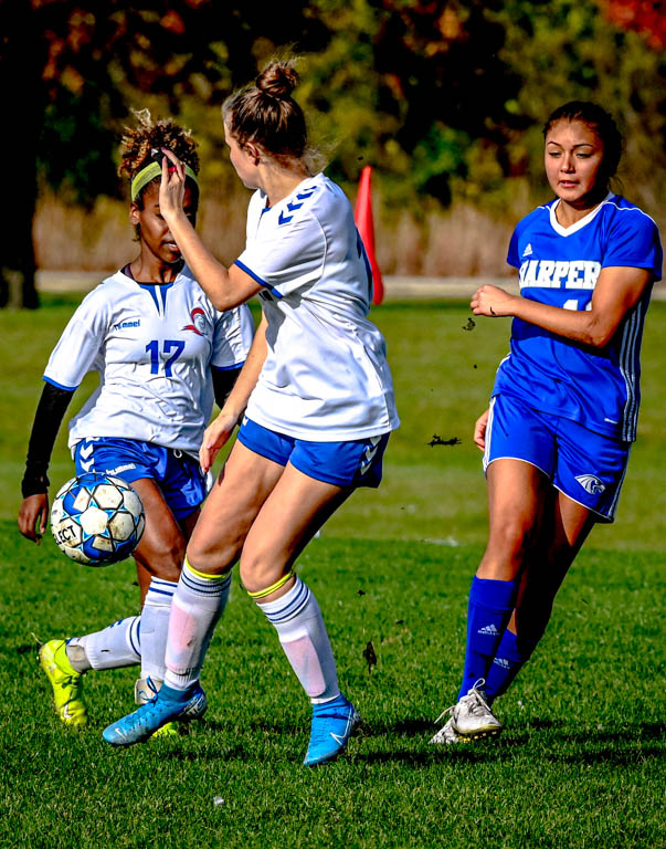 Lady Spartan soccer team heads to division semifinals with 3-0 win over Harper College.