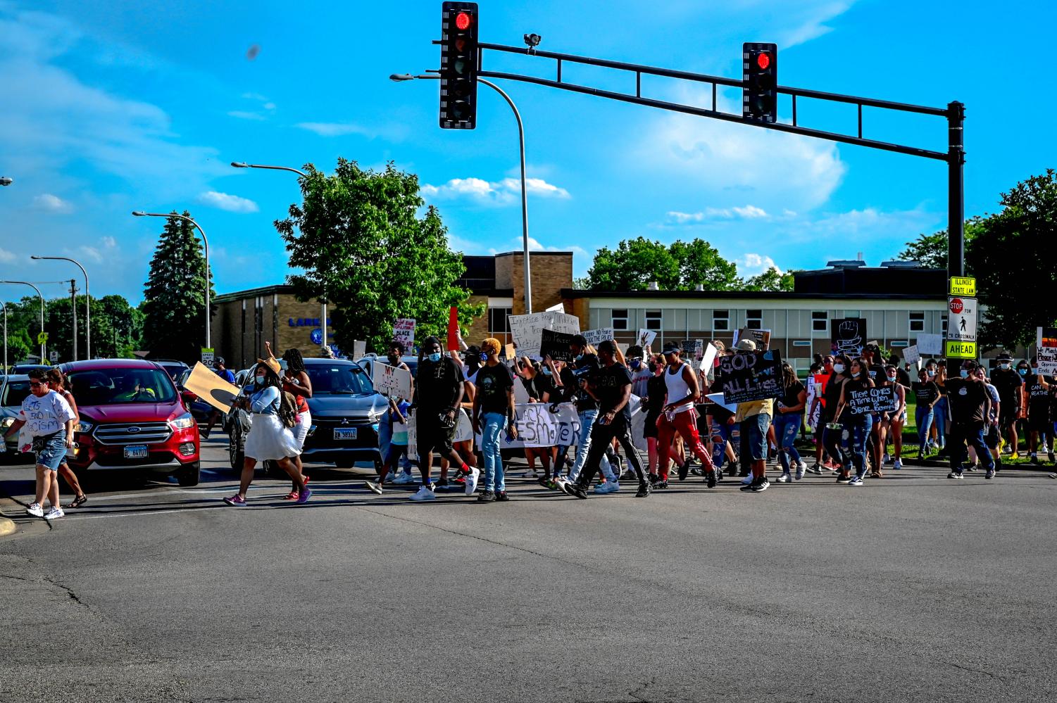 Protesters march from ECC to Elgin Police Department