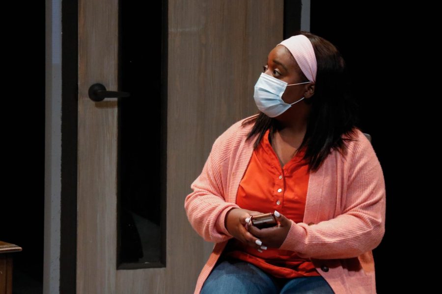 Tremeisha Grays character, Shelby, cant silence her new phone in a scene of Baltimore, by Kirsten Greenidge, the fall play production at ECC.