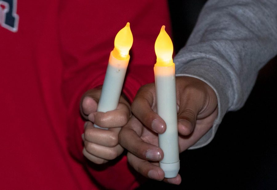 Students held candles during the candlelight vigil concluding Domestic Violence Awareness Month on Oct. 28. 