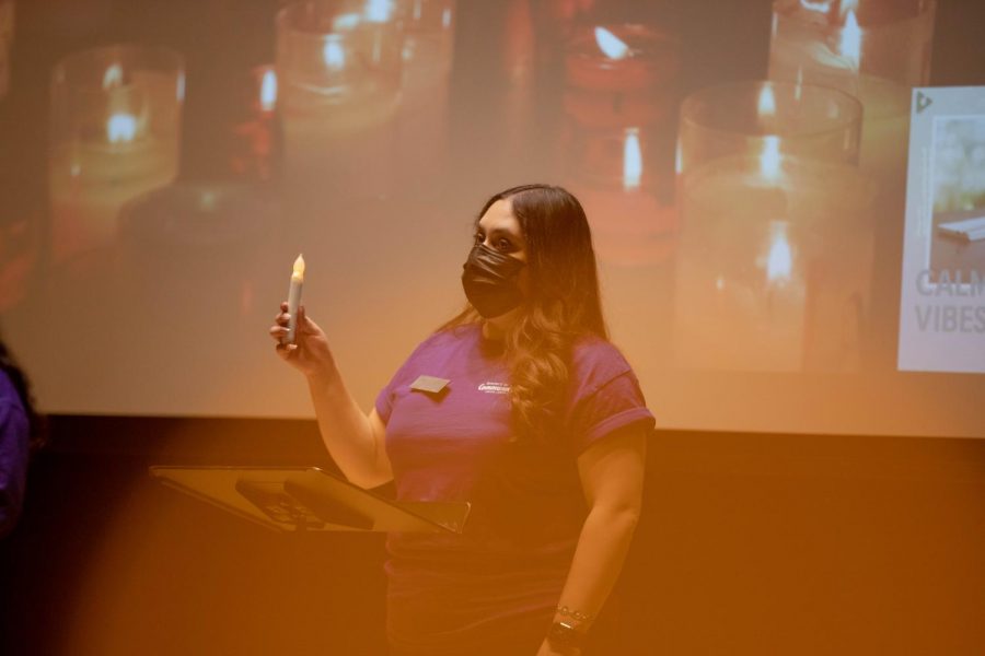 Domestic Violence Team Court Advocate, Araceli Munoz Salazar, raises up candle to honor victims of Domestic Violence on Oct. 28. 