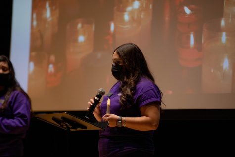 Domestic Violence Team member Araeli Munoz Salazar leads a candle light vigil to honor victims of domestic violence on Oct. 28 in the Spartan Auditorium.