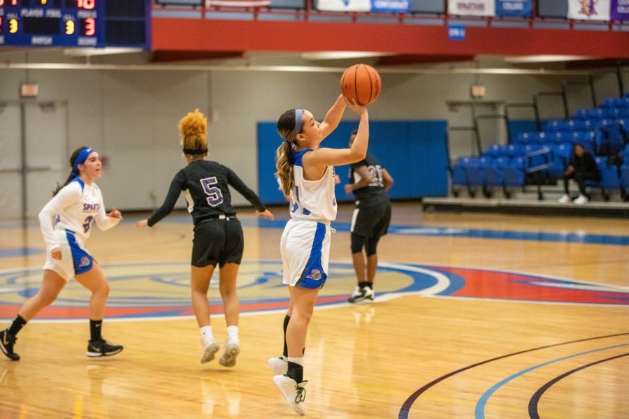 Guard Trinity Reyes shoots a three pointer against Olive-Harvey College on Nov. 9. The Lady Spartans have a 1-3 record as of Nov. 21.
