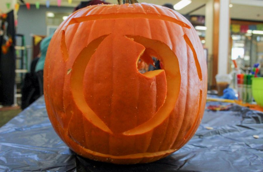 A pumpkin carved in the shape of the Observers logo at ECCs Fall Fest.