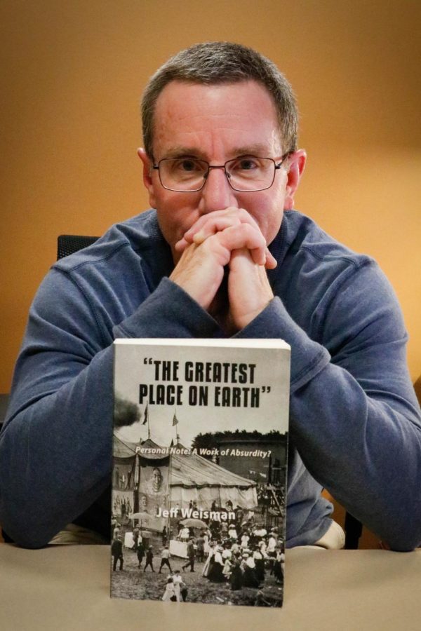 Jeffrey Weisman with his newest book, The Greatest Place on Earth.