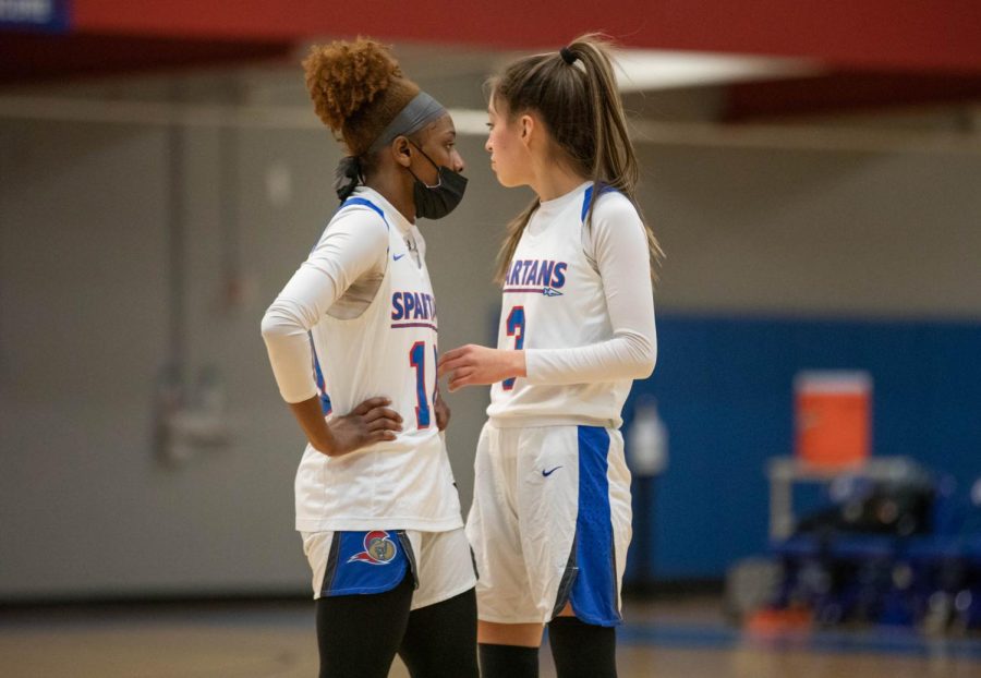 Guards Takara Campbell and Arianna Franco go over the next play on Jan. 25. 
