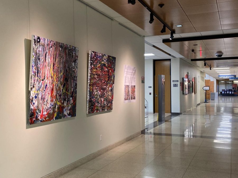 Make Your Mark splatter painting by 34 ECC community member participants hangs in the E. Max von Isser Gallery.