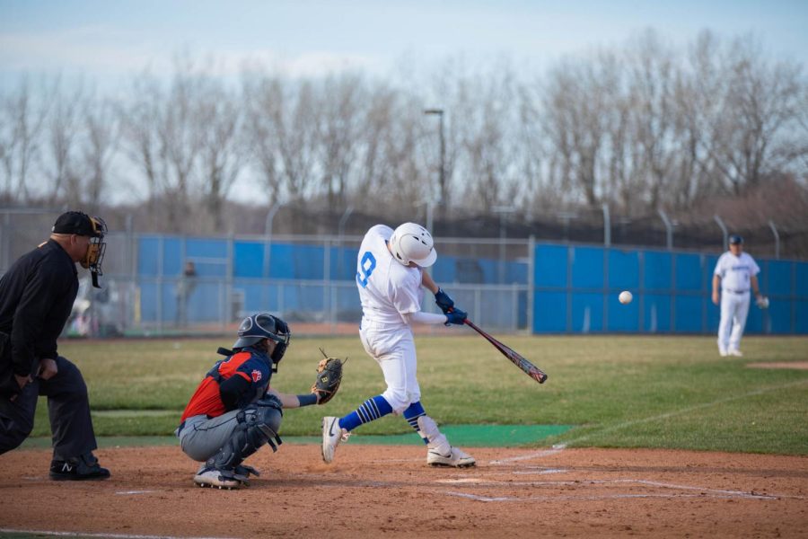 Shortstop Logan Riley hits the ball against Morton College on April 11. 