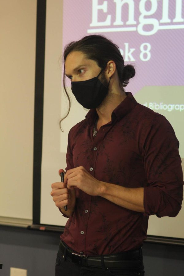 Dr. Kellen Bolt teaches his class with a mask on. 