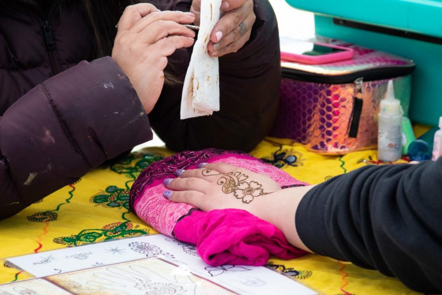 An attendee of Asian Pacific Month was given an Henna tattoo.