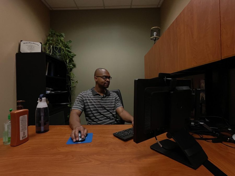 ECC Wellness Professional Coresair Mack does paperwork in his office.