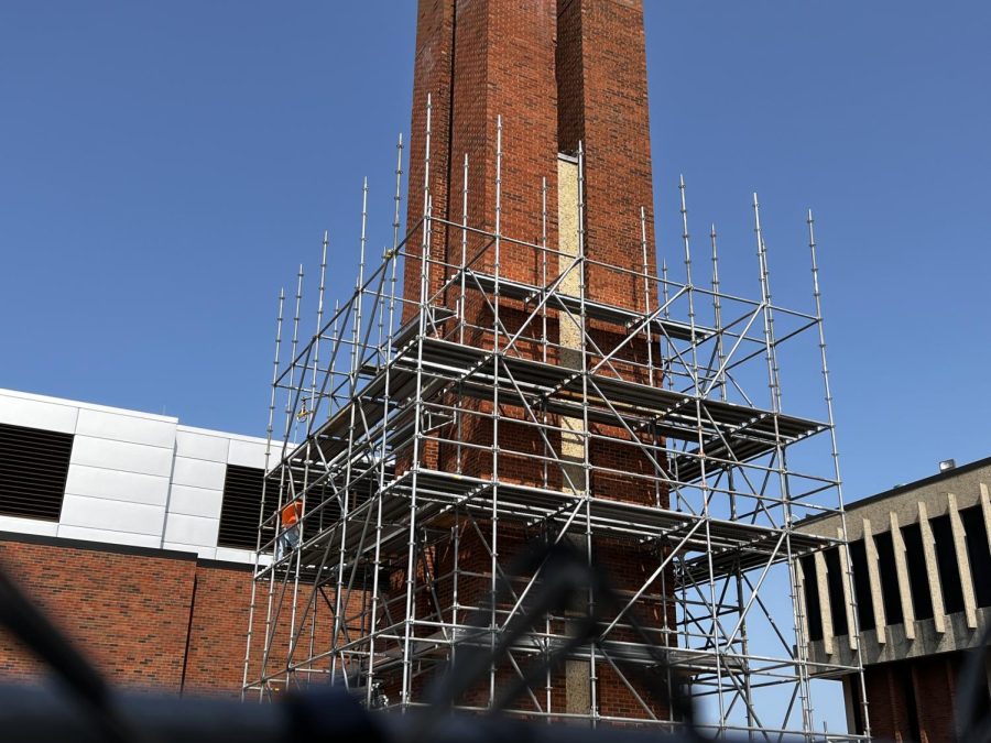 The brick chimney between Building D and F is underway construction. 