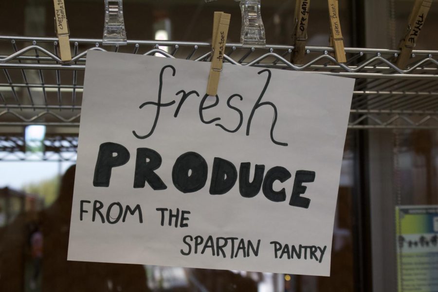 The fresh produce sign on the vegetable rack. 