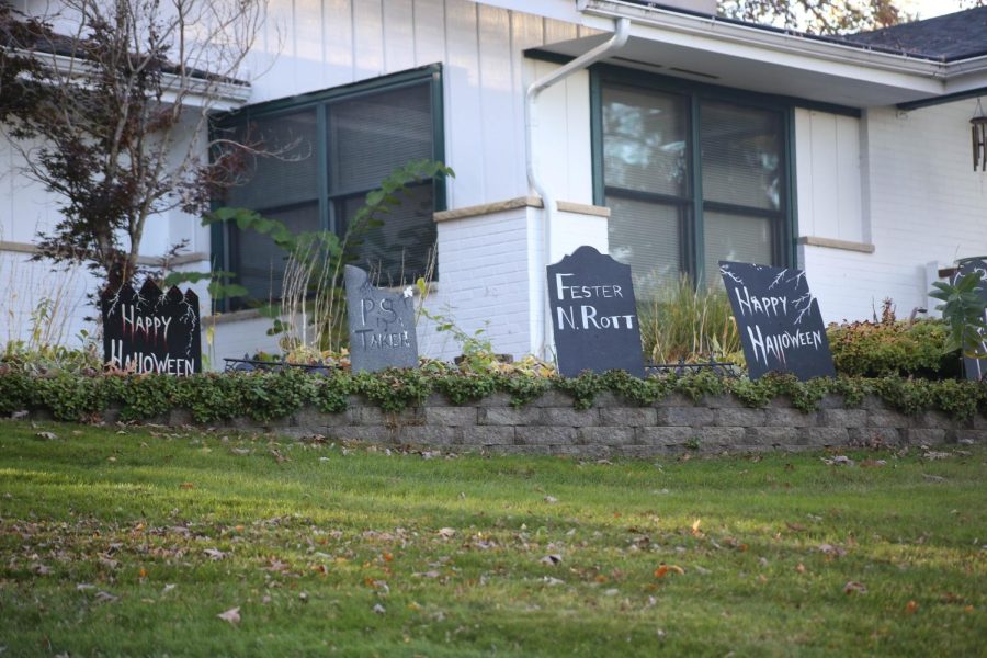 Four decorated tombstones sit outside of a hilltop house in West Dundee.