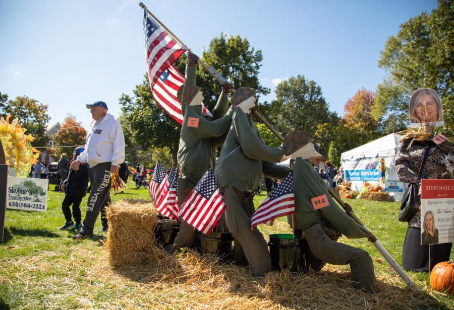 Boy Scouts of America Troop 1 of St. Charles sits in St. Charles Lincoln Park during Scarecrow Weekend on Oct. 8, 2022. 