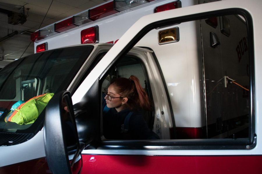 EMT Anna Altman climbs into an ambulance at the Burlington Community Fire Protection District on Nov. 20, 2022. 