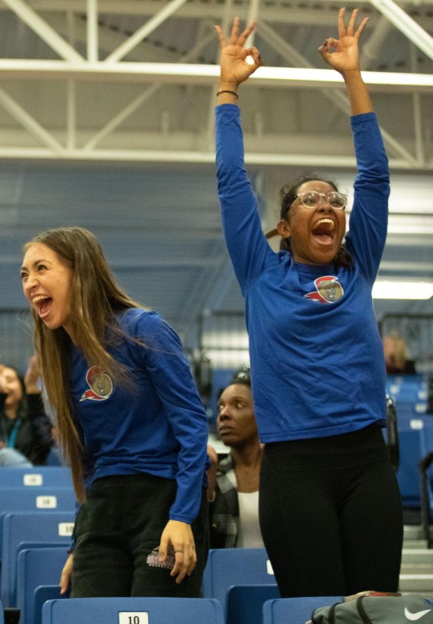 Lady Spartans basketball players Ari Franco, left, and Ari Marchan cheer on the men’s basketball team during their game against Milwaukee Area Technical College on Nov. 3, 2022. 