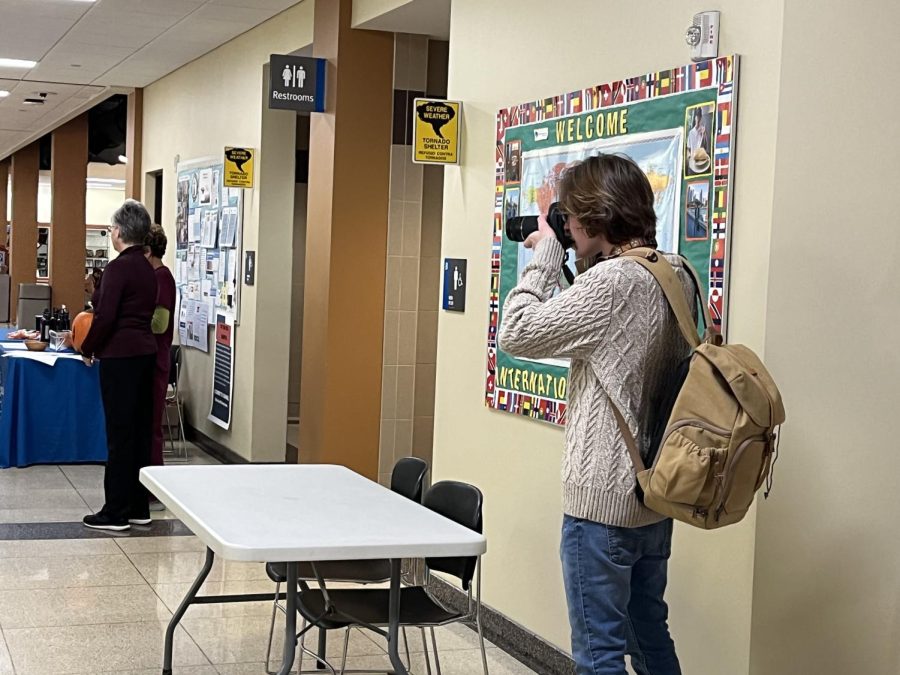 Matt Brady, the 2023-2024 editor-in-chief, shoots photos at a campus event. The Observer is a great place to learn how to shoot pictures using your phone or with a camera. 
