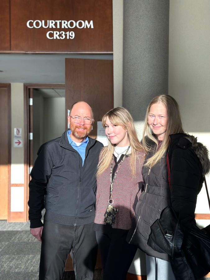 Hannah Soukup celebrates with her biological parents, Philip Soukup (left) and Shelly Nielsen (right), after her stepfathers sentencing on Nov. 30.