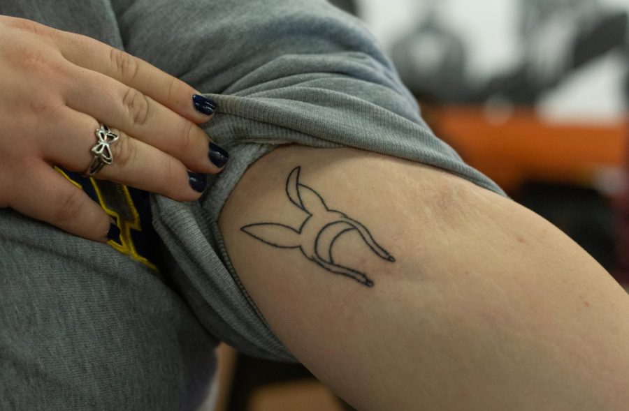 ECC student Maddie Wilson shows off her Bobs Burgers bunny ears tattoo.
