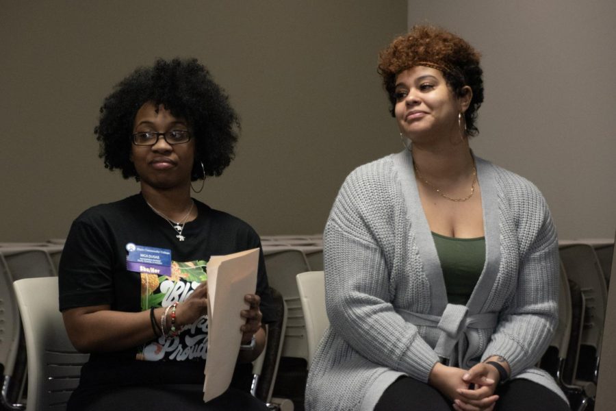 EDI Administrative Assistant Mica Dugas (left) and student Tyra Benson listen at Conscious Conversations event in the Building B Heritage Room on Feb. 8, 2023. 