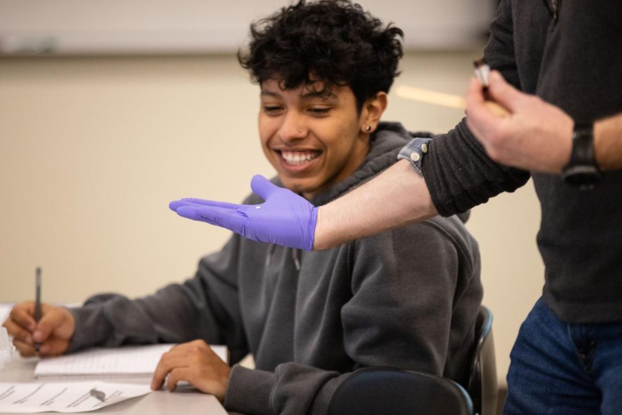 Instructor Dave Strossner shows second-year student Cesar Palomares a Nitroglycerin pill during his lesson on pharmacology at the Elgin Community College Center for Emergency Services in Hampshire  on Thursday, Feb. 9, 2023. 