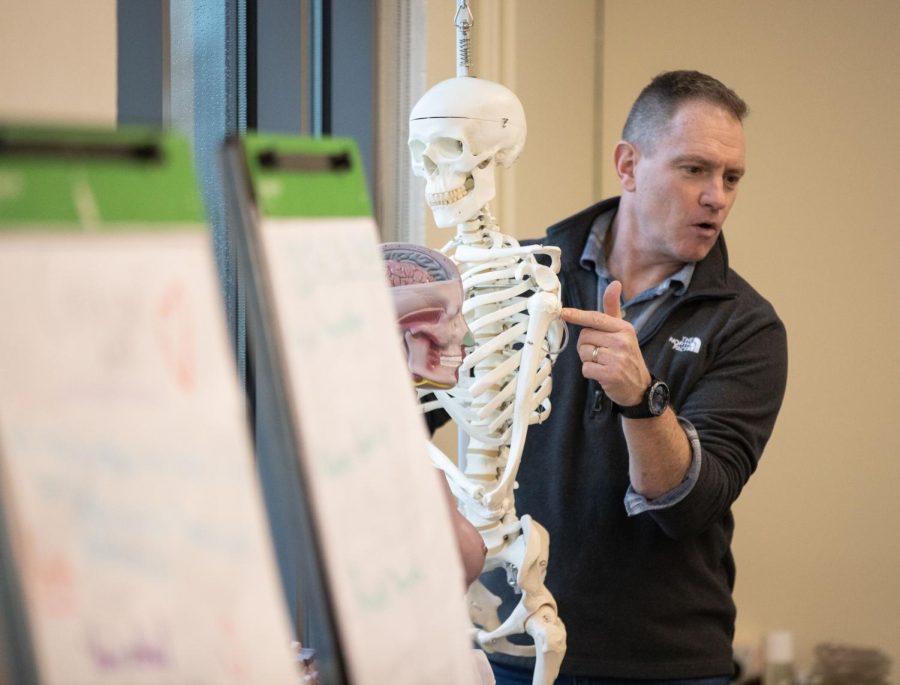 Intstructor Dave Strossner demonstrates how medicine can be administered through intraosseous infusion (through a bone) during his lesson on pharmacology at the Elgin Community College Center for Emergency Services in Hampshire  on Thursday, Feb. 9, 2023. 