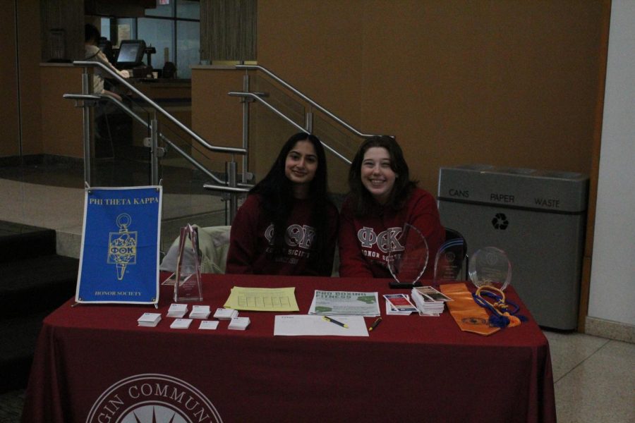 Rani Patel (left) and Ely Thompson (right) sitting behind the PTK booth during the Nacho Ordinary
Club Fair on Jan. 25th, 2023. 