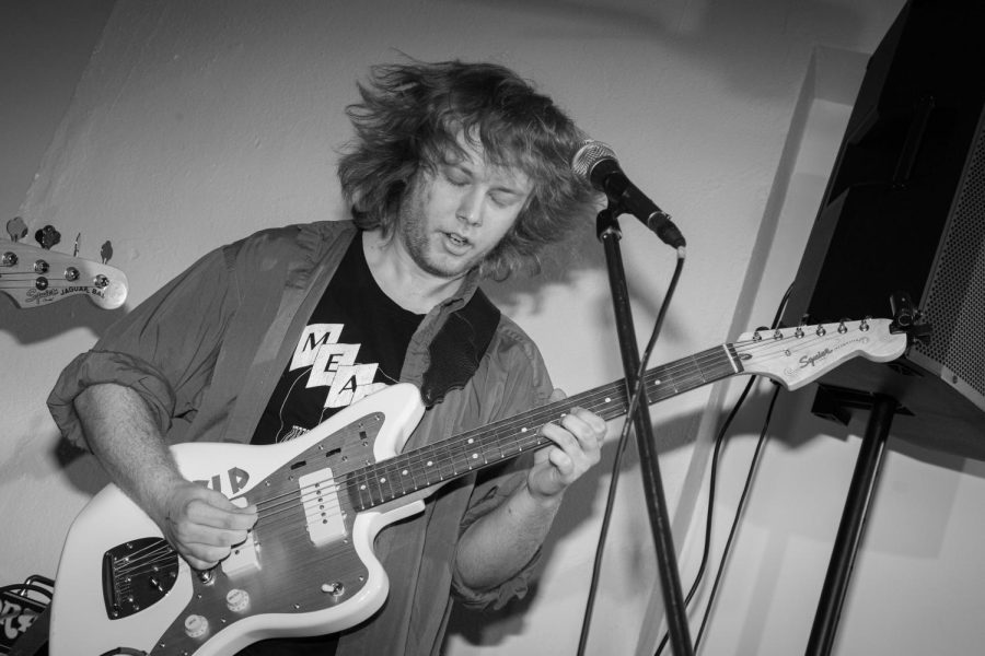 Guitarist of the band Inpo, Brendan Markwood, makes his hair fly at the Issue 003 Release Party on Feb. 11, 2023.