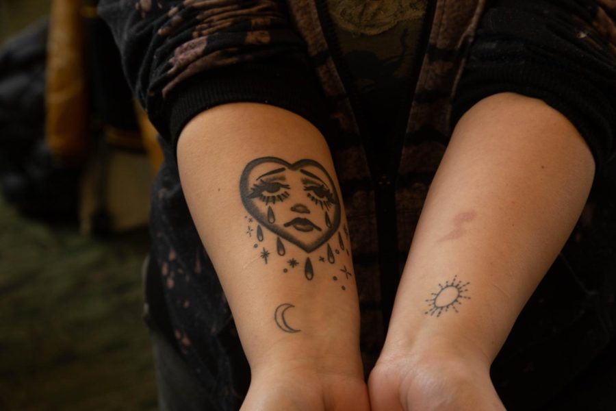 ECC student Sophia Feliciano shows off her multiple tattoos inked across her arms. Her first tattoo was the moon, which she got when she was 15 in a basement at a punk rock concert. 