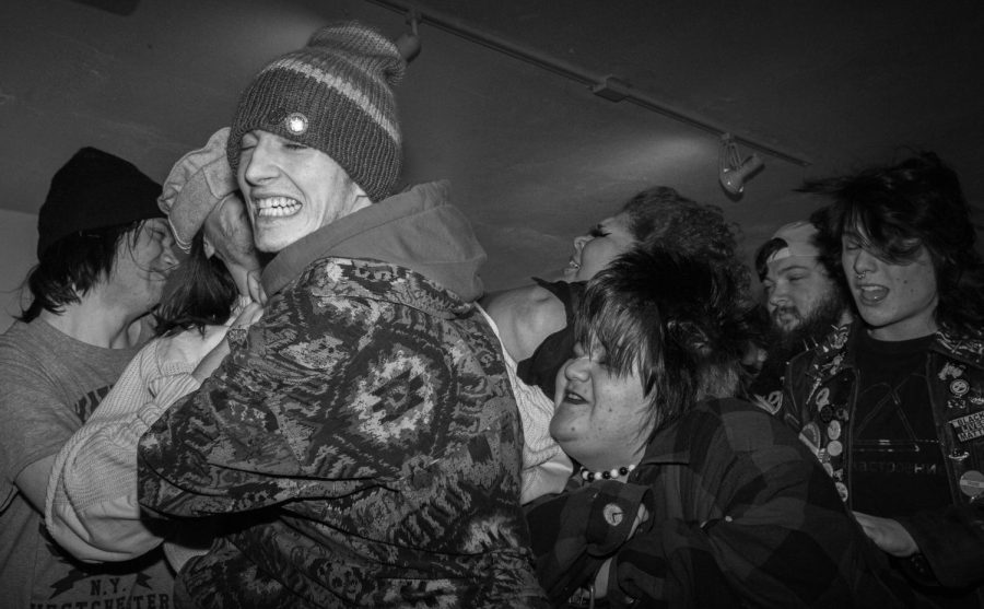 Energetic attendees mosh in the middle at the Issue 003 Release Party on Feb. 11, 2023.