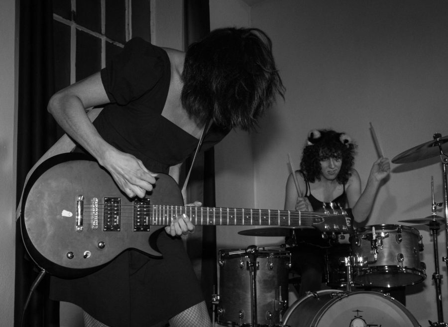 Guitarist Zamora (left) and drummer Jessica (right) of the band Ovarian Cystas get down to the groove at the Issue 003 Release Party on Feb. 11, 2023.