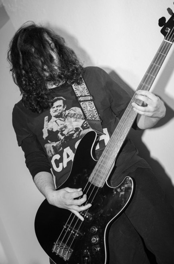 Bassist for the band La Rosa Noir, Kevin Martinez, lays down a groove at the Issue 003 Release Party on Feb. 11, 2023.