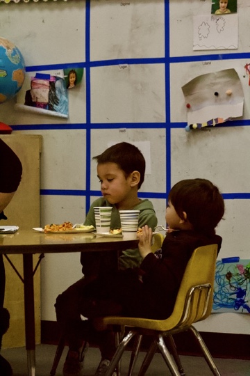 One of the kids working with the Early Development Staff and Students, while eating. Picture was taken on Mar. 3, 2023.