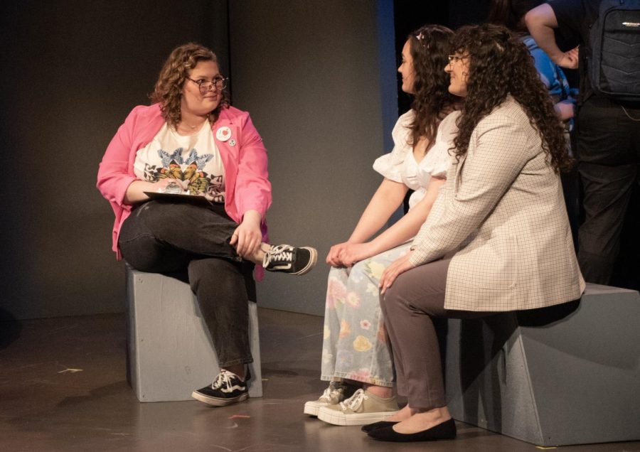 Kelly (left), played by Olivia Litton, addresses mother-daughter duo Sam (center), played by Gabrielle Urbina, and Beverl, played by Pamela Hart, in the Spartan Auditorium on Feb. 23, 2023. 