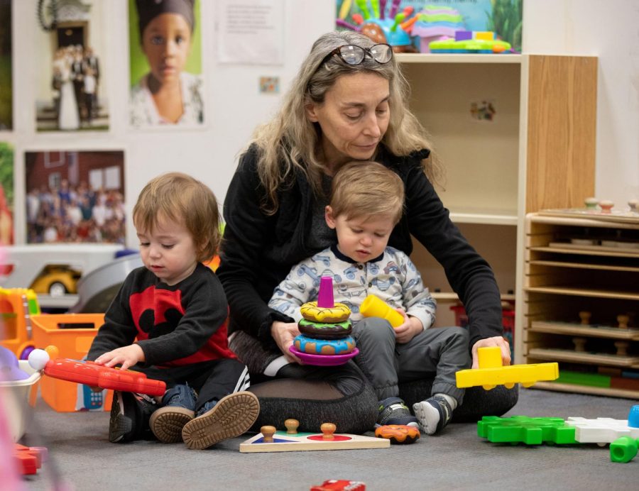 Natalie Gagliano plays with toddlers during playtime at ECCs Early Childhood Lab School on March 2, 2023. 