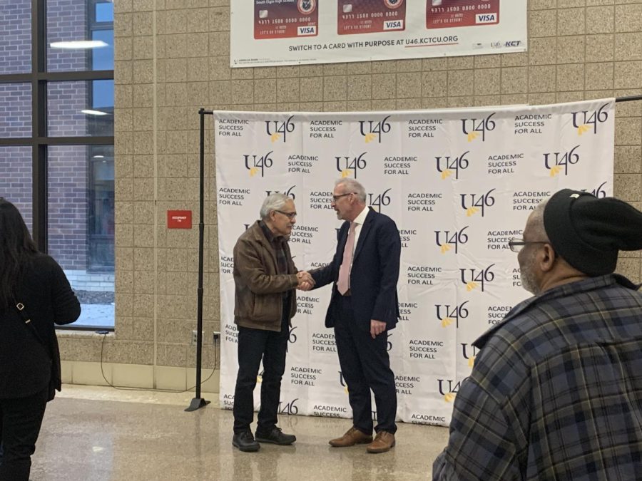 Dr. Tony Sanders during the reception shaking hands with an attendee at his farewell celebration at South Elgin High School on Feb. 15, 2023.