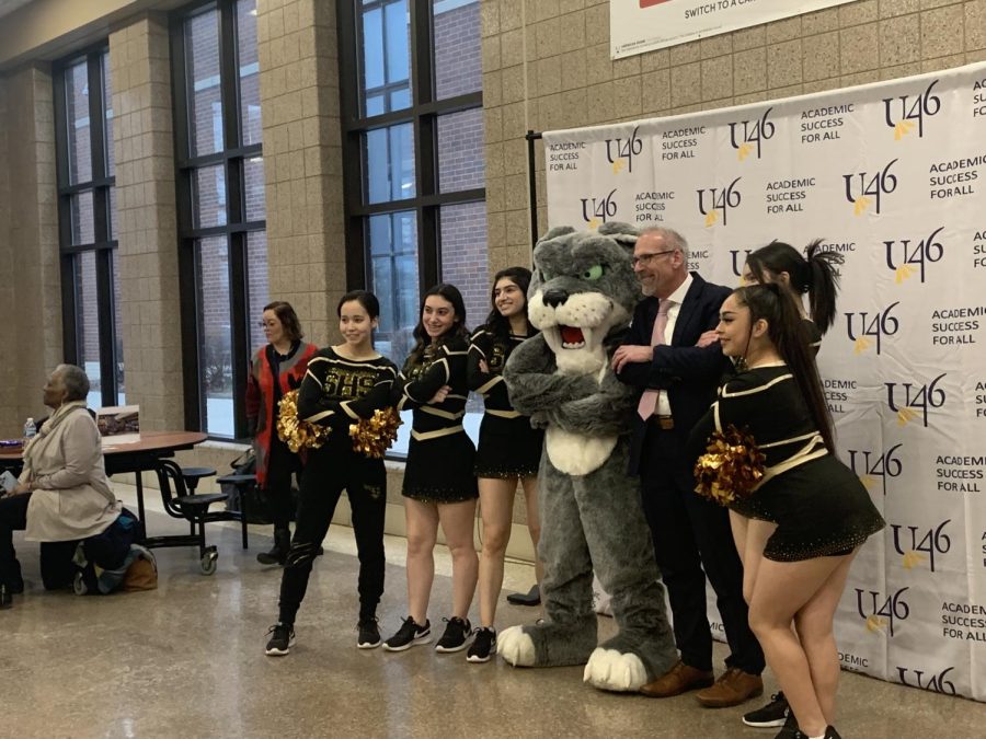 Dr. Tony Sanders during the reception posing with Streamwood Highs dance team and mascot at his farewell celebration at South Elgin High School on Feb. 15, 2023.