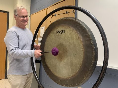 Musics of the World Professor Jeff Hunt plays the gong.
