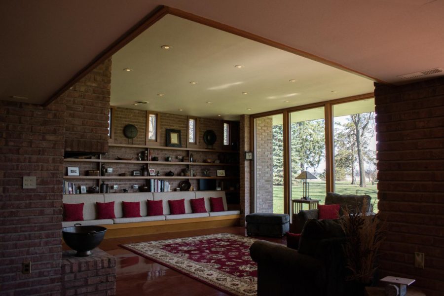 The living room inside the Frank Lloyd Wright-designed Muirhead Farmhouse in Hampshire, IL on April 6, 2023. Recessed lights are located above the center of floor concrete tiles throughout the home.