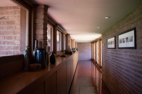 The entry hallway to the Frank Lloyd Wright-designed Muirhead Farmhouse in Hampshire, IL on April 6, 2023. Built of Chicago brick and Southern cypress, the home features a heated concrete floor.