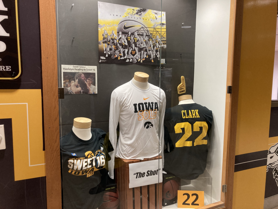 A case of Iowa-themed sports apparel, centered around the womens basketball team, displayed outside the Hawk Shop bookstore inside the Iowa Memorial Union.