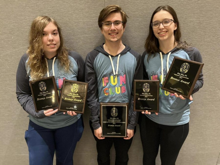 Forensic team members Aleah Janae, Damian Hacz, and Hannah Carpenter celebrate at the Phi Rho Pi national speech and debate tournament. This years tournament was hosted in Bethesda, Maryland from April 10-15.