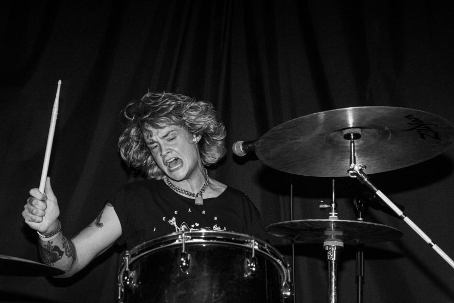Drummer Fred Mason thrashes and energetically drums through a song at the DIY Chicago venue Bookclub on April 16, 2023.